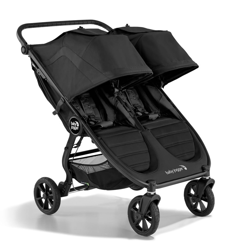 black baby jogger city mini gt2 side-by-side double stroller with two large canopies