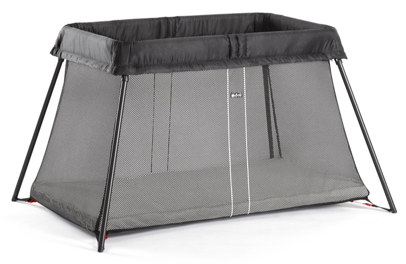 black babybjorn travel crib light with mesh sides and a low frame