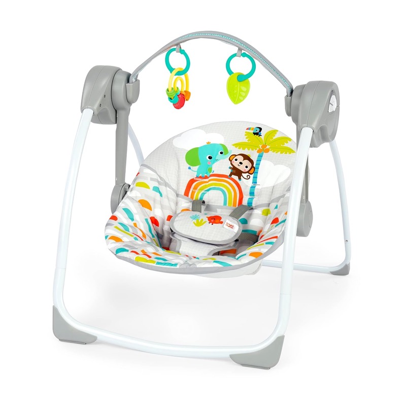 bright starts portable baby swing with a colorful jungle print seat and two hanging toys