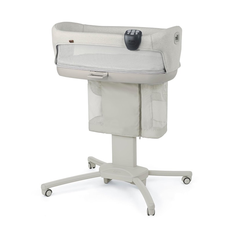light oat chicco close to you bedside bassinet with mesh panels on a wheeled stand