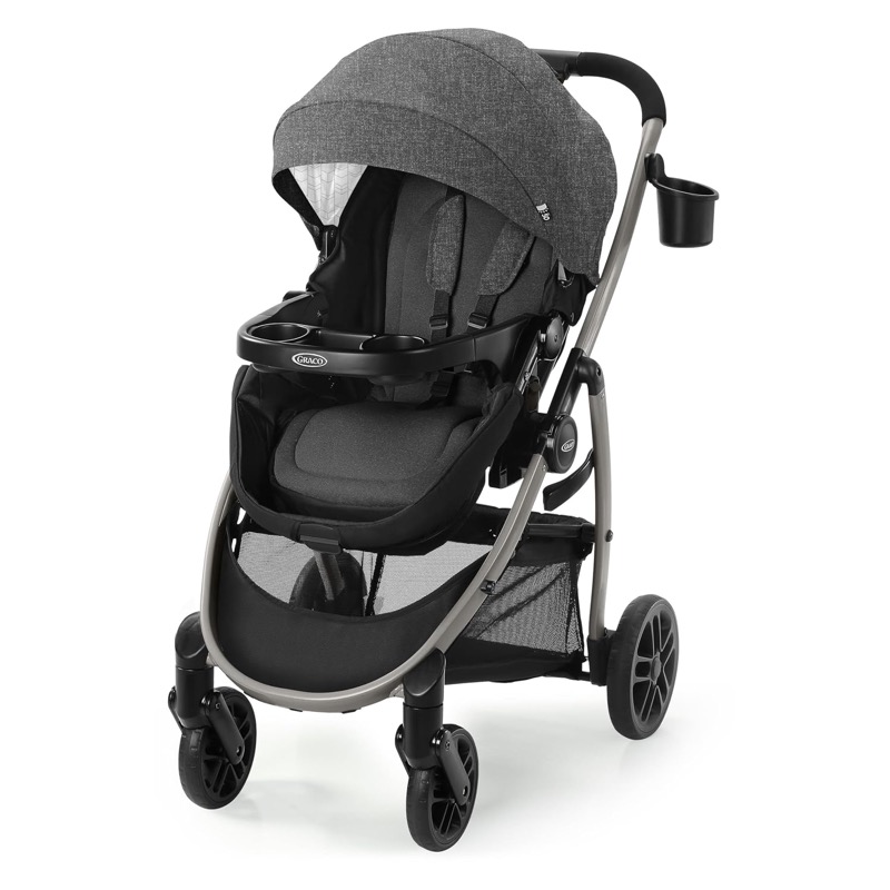 gray and black graco modes pramette stroller with a large canopy, a child tray and a storage basket
