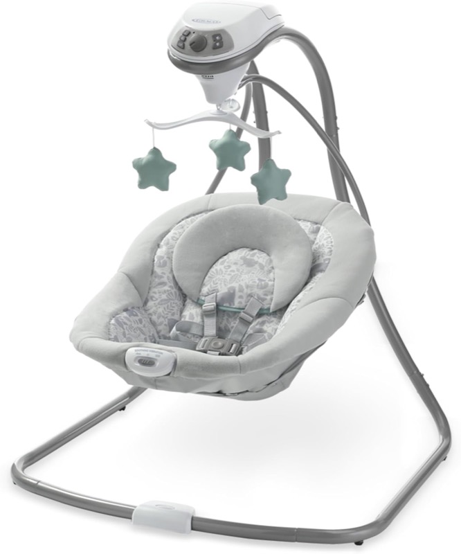 light gray graco simple sway baby swing with a star mobile above a deep padded seat