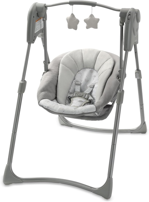 gray graco slim spaces compact baby swing with a padded seat and two star toys