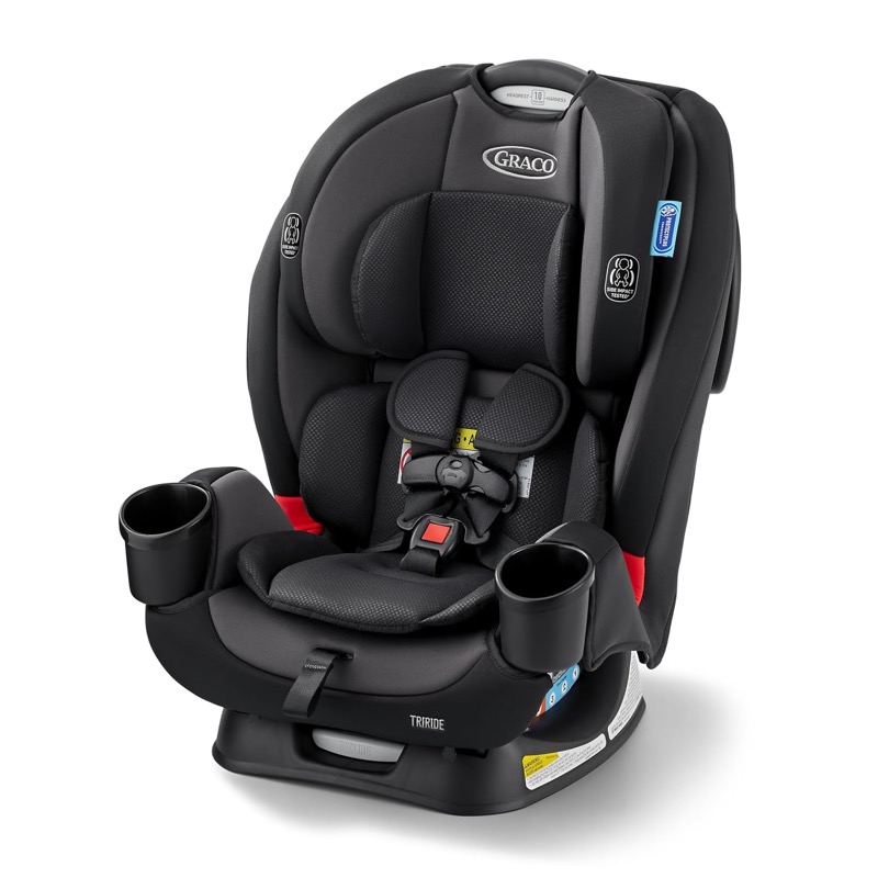 black graco triride three-in-one convertible car seat with a five-point harness and cup holder