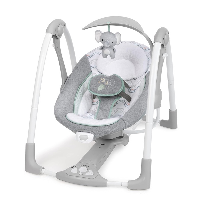 gray ingenuity convertme portable baby swing with an elephant toy on a curved toy bar