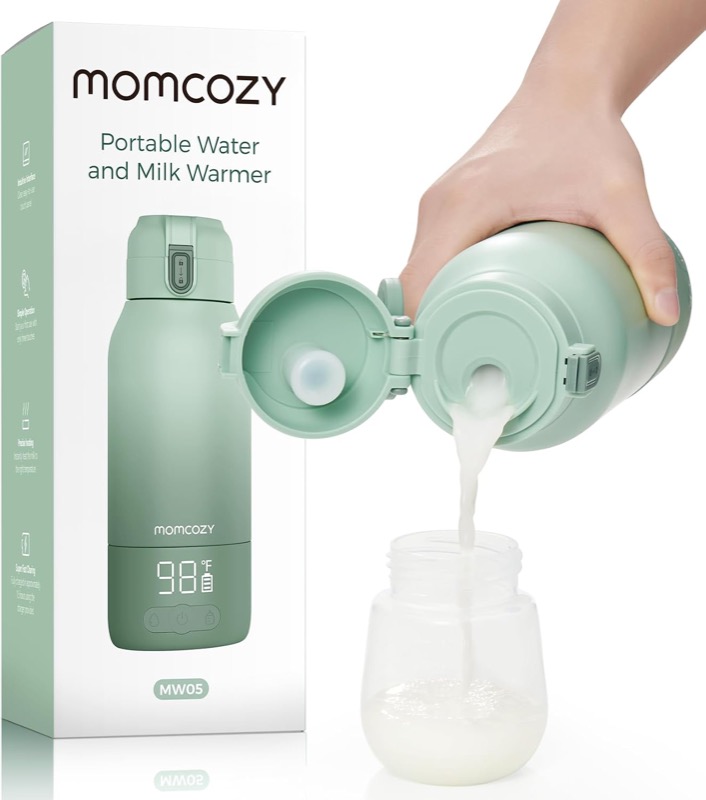 green momcozy portable bottle warmer flask pouring warm water into a baby bottle