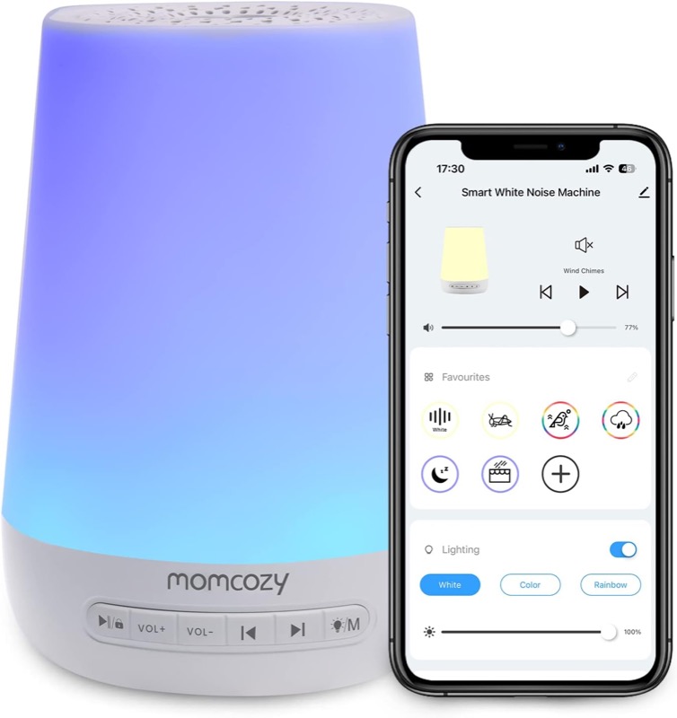 white momcozy smart sound machine glowing purple and blue next to a phone showing its app