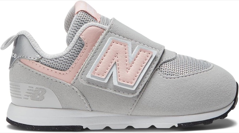 light gray new balance 574 baby sneaker with a pink n logo and a hook-and-loop strap