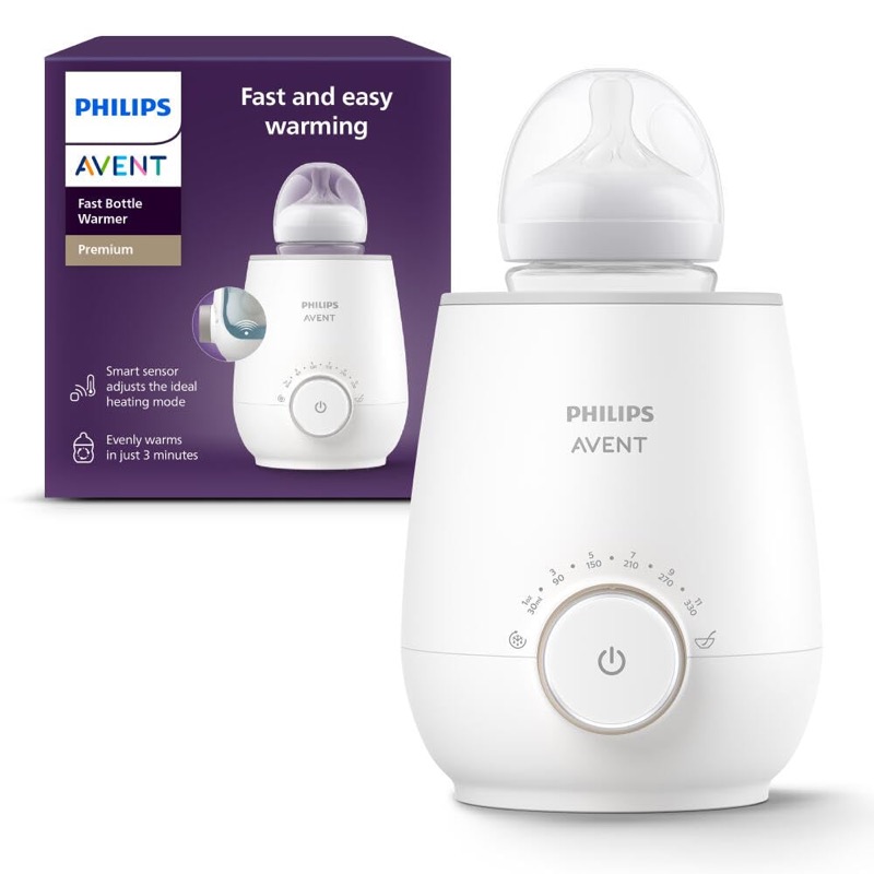 white philips avent premium fast bottle warmer holding a baby bottle next to its box