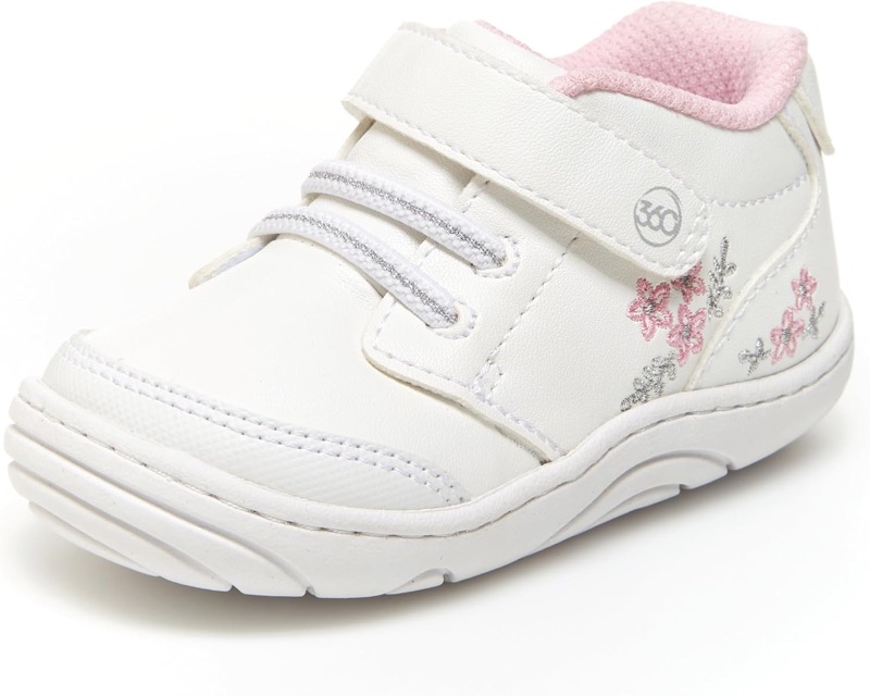 white stride rite taye 2.0 baby sneaker with pink trim and a hook-and-loop strap
